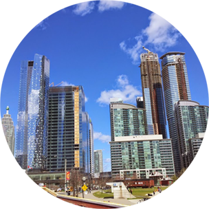 Skyscrapers in Vaughan, Canada, in front a backdrop of bright blue skies.