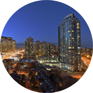 City buildings in North York, Canada, at nighttime, with city lights dotted throughout.