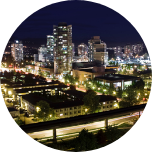 Nighttime city scene of Brampton, Canada, with lots of buildings and lights.