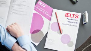 Two students reviewing IELTS General Writing