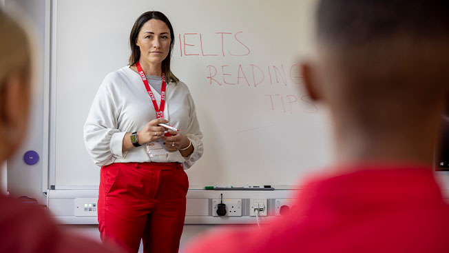 Teacher preparing her students for the IELTS language assessment test